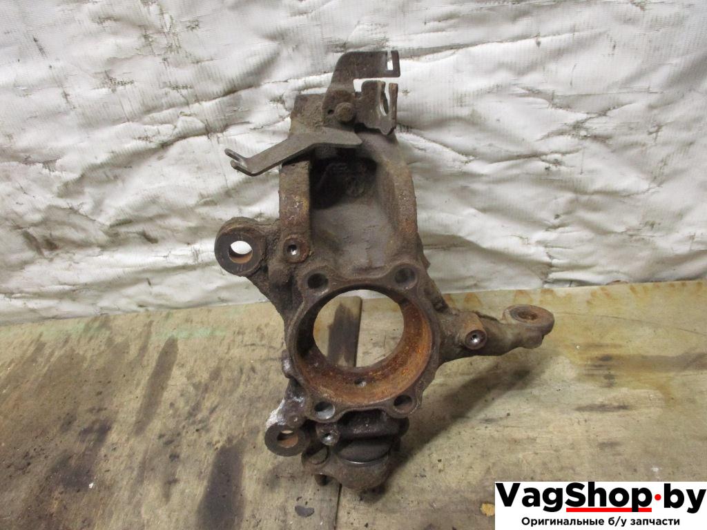 кулак поворотный левый Volkswagen Tiguan 1 поколение 2010, 2.0 л., TDi, CFF, дизель, МКПП, черный, внедорожник 5 дв., передний привод - фото №1