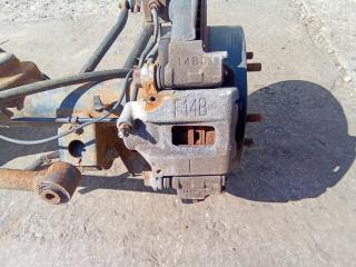 суппорт задний левый Toyota Land Cruiser J100 [2-й рестайлинг] 2006