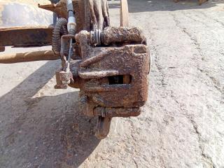 суппорт задний левый Renault Trafic 2 поколение 2004