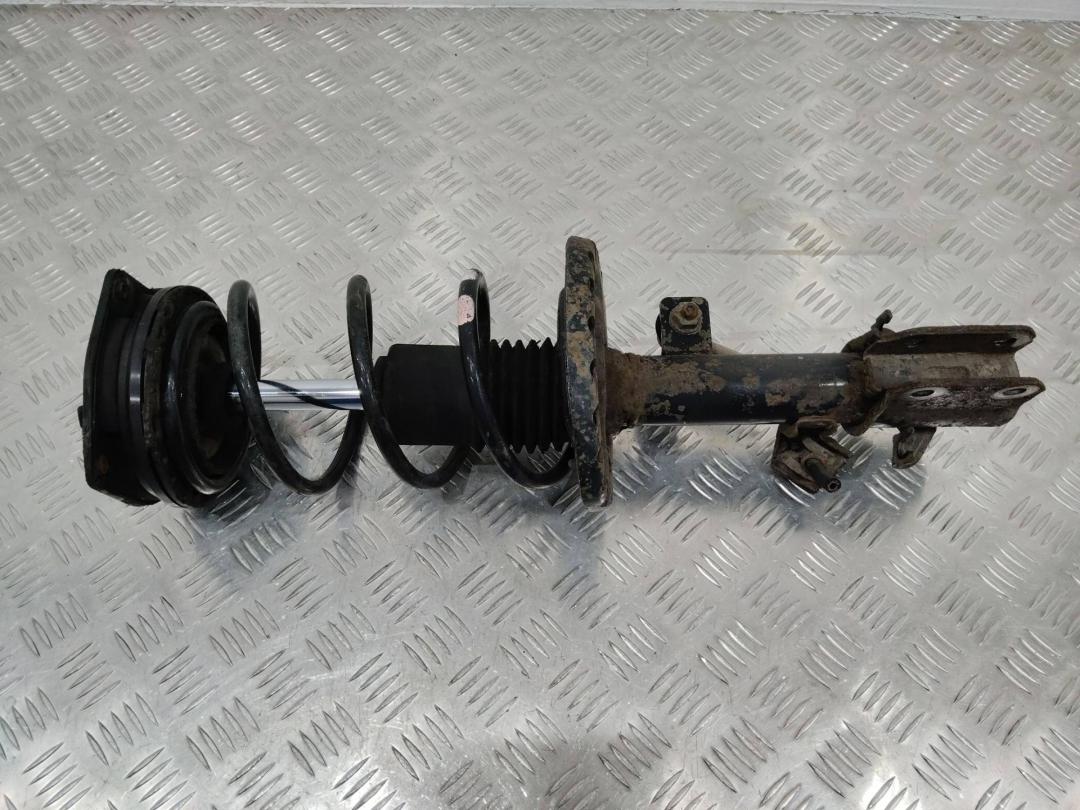 амортизатор передний левый Nissan Micra 3 поколение (K12) 2003 - фото №1