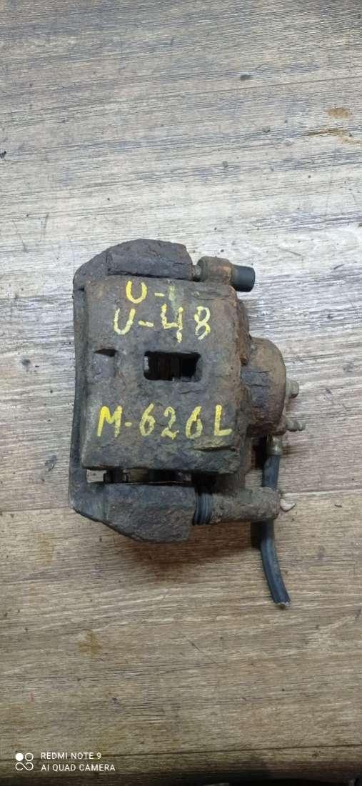 суппорт передний левый Mazda 626 GE 1996, 2.0 л., бензин, МКПП, седан - фото №1