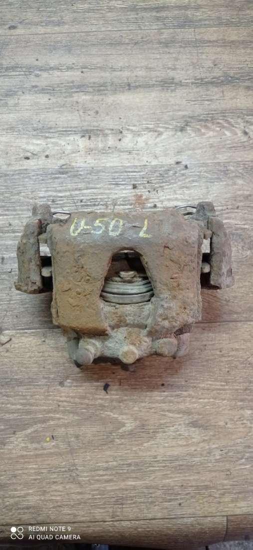 суппорт передний левый Opel Corsa A 1992, 1.2 л., бензин, МКПП, хетчбэк 5 дв. - фото №1