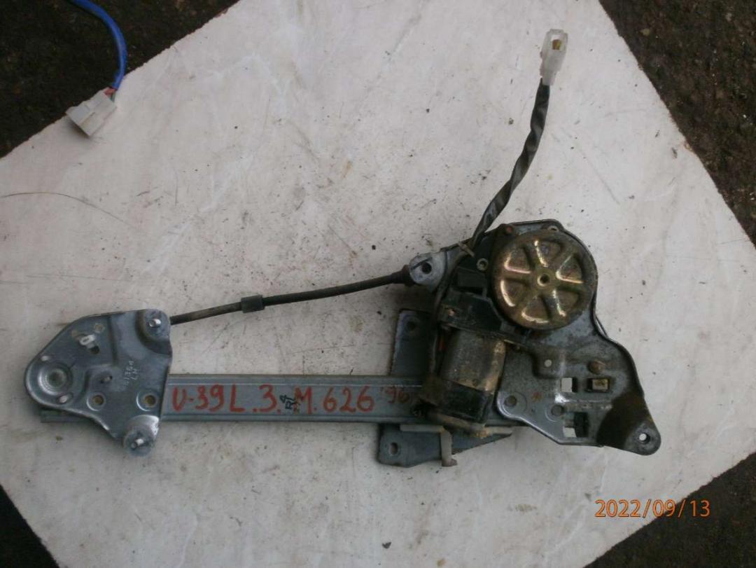 стеклоподъемник электрический задний левый Mazda 626 GE 1996, 2.0 л., TD, дизель, МКПП, седан - фото №1