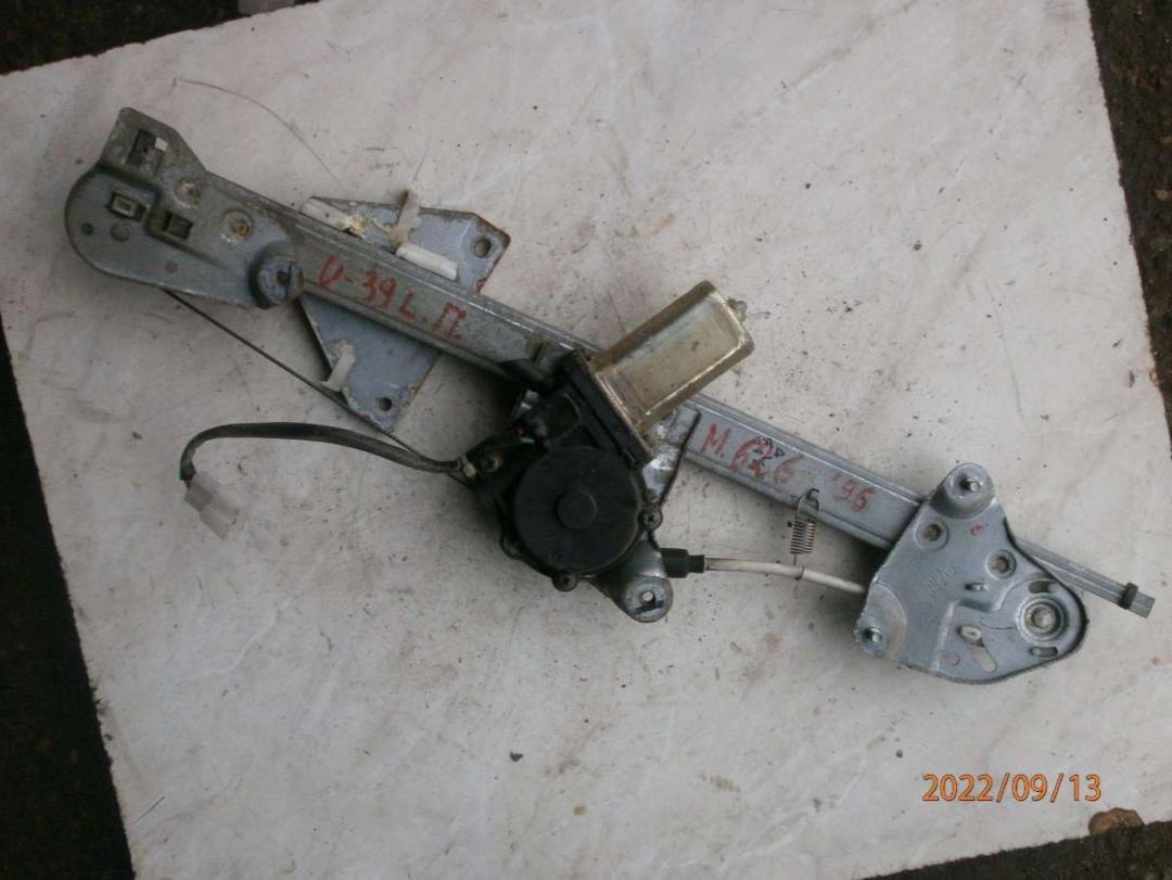 стеклоподъемник электрический передний левый Mazda 626 GE 1996, 2.0 л., TD, дизель, МКПП, седан - фото №1