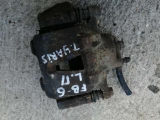 суппорт передний левый Toyota Yaris P1 2001, 1.0 л., бензин, МКПП, хетчбэк 5 дв.