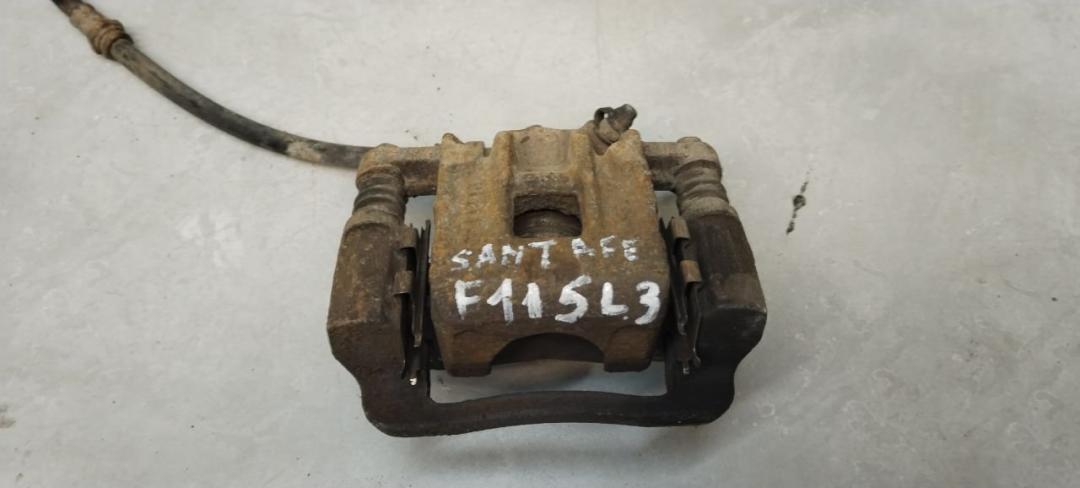 суппорт задний левый Hyundai Santa Fe 1 поколение (SM) 2003, 2.0 л., дизель, АКПП - фото №1