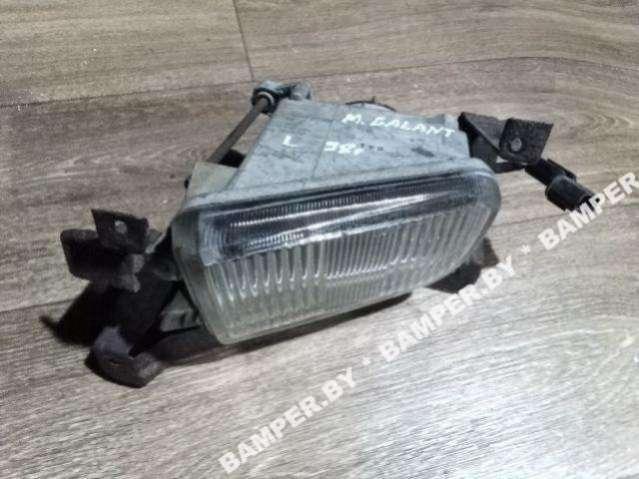 фара противотуманная левая Mitsubishi Galant 8 поколение 1998 - фото №1