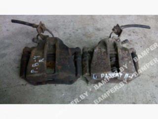 суппорт передний левый Volkswagen Passat B4 1994
