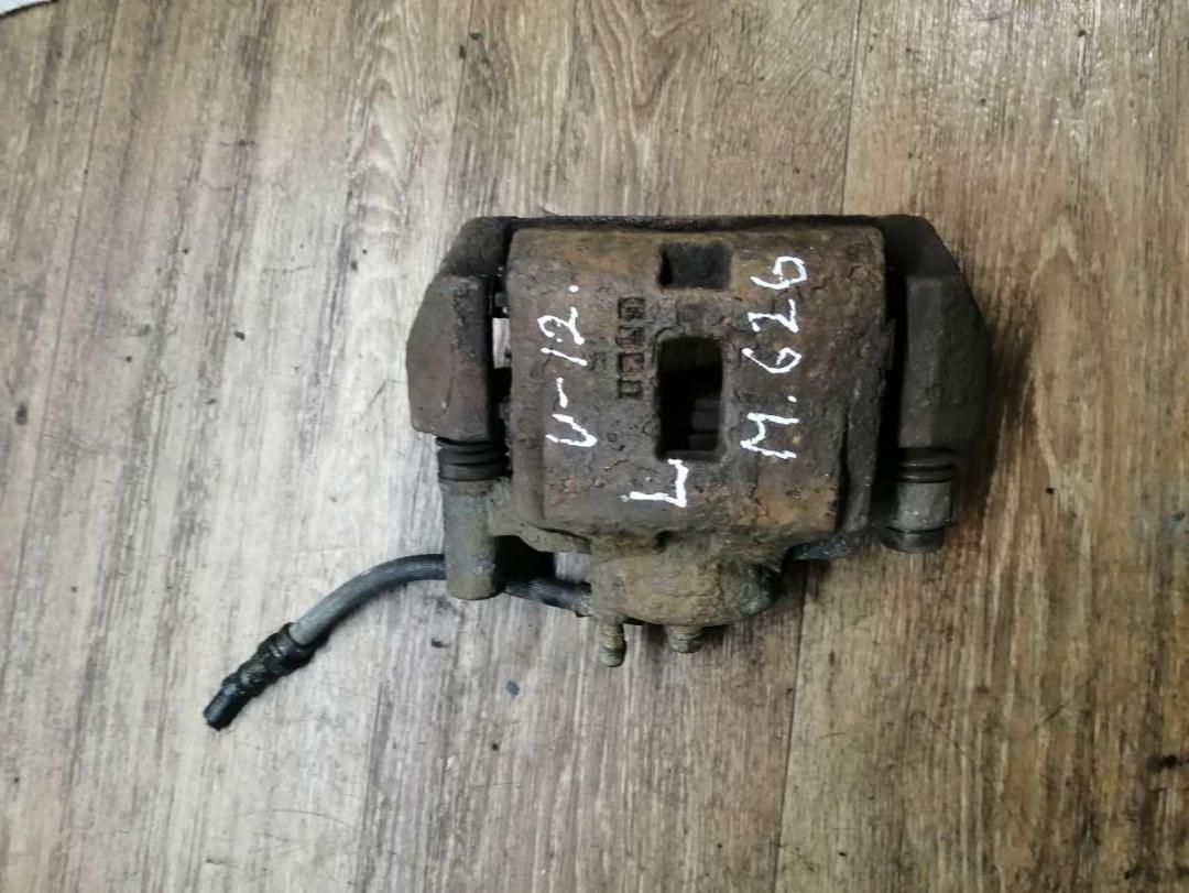 суппорт передний левый Mazda 626 GE 1995, 2.0 л., бензин, МКПП, седан - фото №1