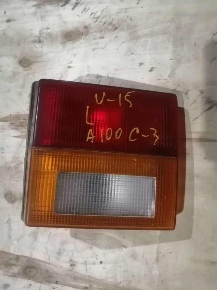 фонарь крышки багажника левый Audi 100 C3 1986, 1.8 л., бензин, МКПП, универсал - фото №1